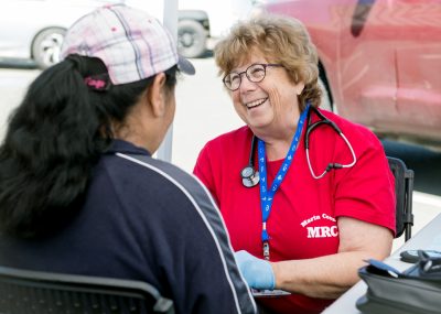 dsc_2098rt Volunteer Mary Frankel, RN, MFT screens a
Health Hub attendee