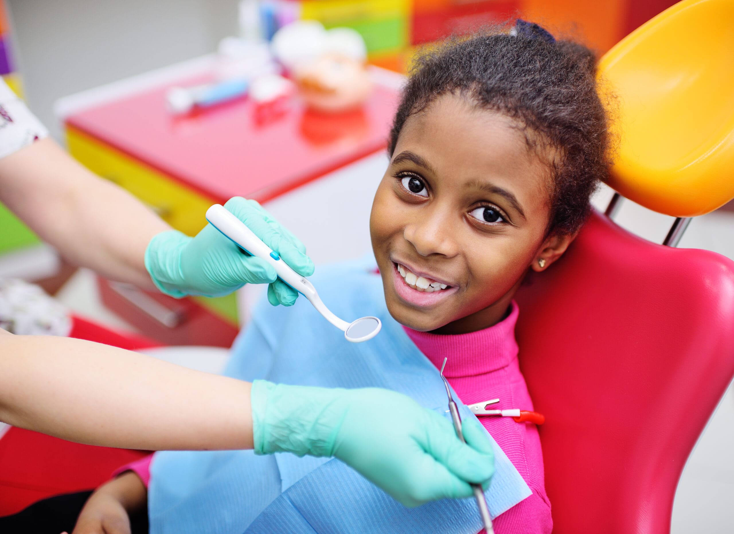 child in dental chair getting examined
